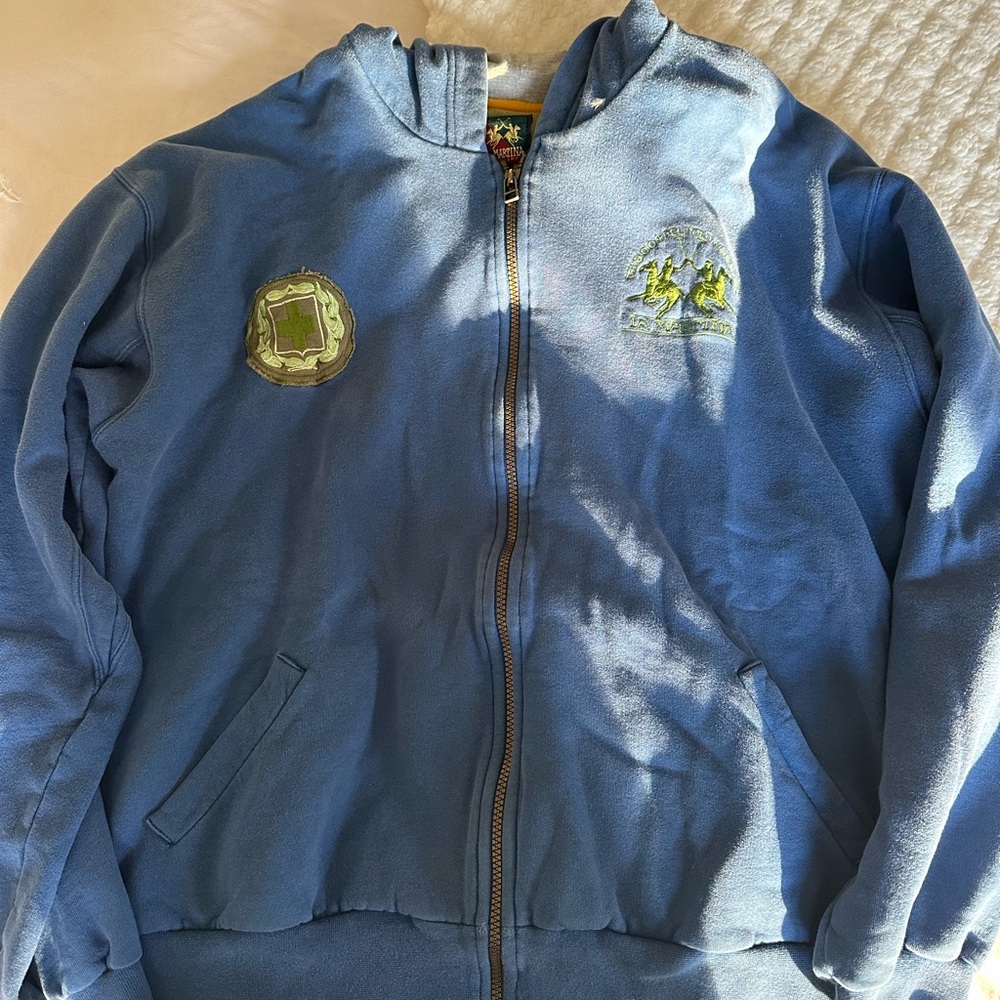 Blue zip up hoodie with patches from La Martina size L.